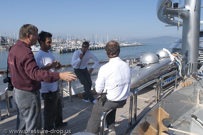 Discussing the placement of Super Falcon on deck of the mother ship<br />
  © www.pressuredrop.us - copyright